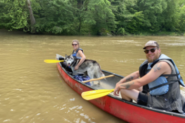 a group of people riding on the back of a boat