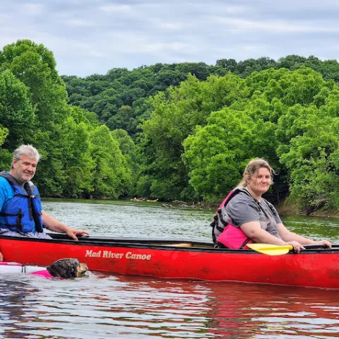 a group of people riding on the back of a boat
