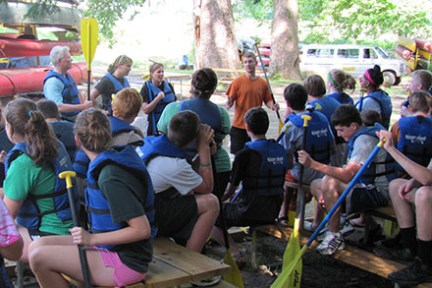 a group of people sitting in front of a crowd