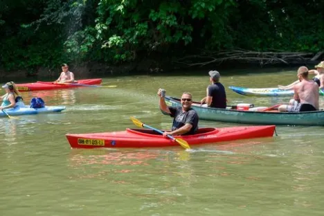 a group of people riding on the back of a boat