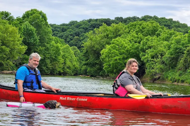 a group of people riding on the back of a boat
