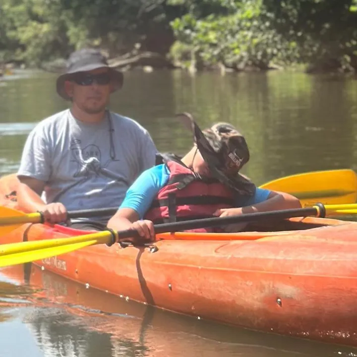 a man rowing a boat in the water