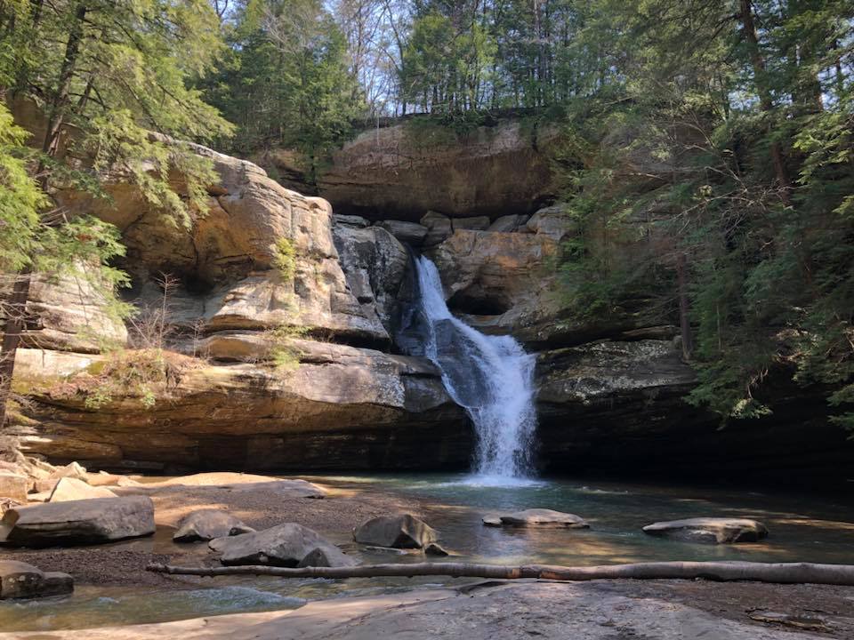 471756546_10161183067857967_7019355261333877773_n a large waterfall next to a rock